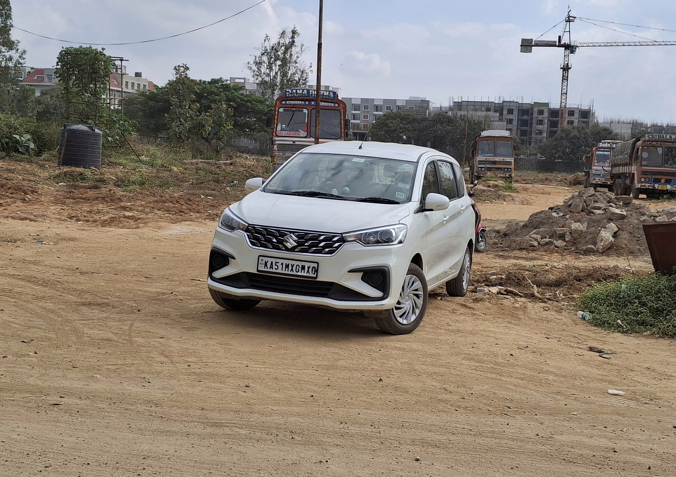 Small white Ertiga travel car